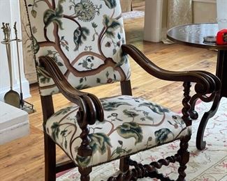 Pair of Jacobean-style carved wood armchairs with barely twist frame with nailhead trim. Crewel embroidery fabric. Measures 50" H. Seat depth 18"  and arm height 29". Photo 2 of 3. 