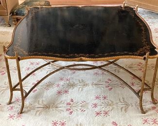 Dennis & Leen ebony with gilt trim cocktail table with gilt faux bois base and crackle finish. Measures 48" x 48" x 20" H. Photo 1 of 3.
