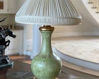 Pair of green painted wood table lamps with ornate gilt base. Measures 12" W x 26" H without shade. 34" H with shade. Photo 1 of 2. 