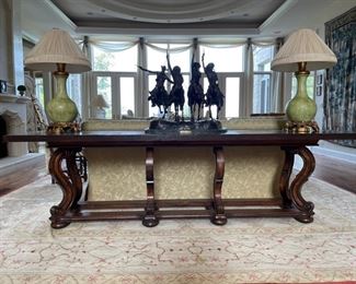 Walnut grand console with brass inlay pinecone detailing. Measures 107" W x 32" H. Photo 1 of 3. 