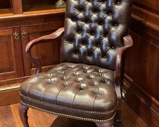 Tufted leather upholstered armchair. Measures 24" W x 18" D x 33" H. 
