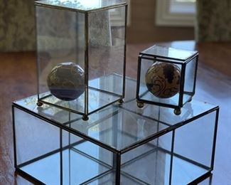 Decorative clear glass display boxes. 