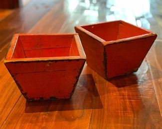 Set of two decorative orange square bowls. Each measures 6" x 6."
