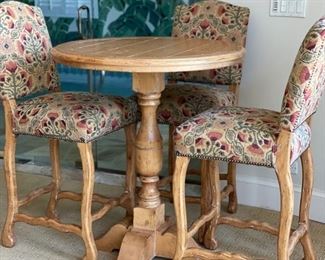 Fremarc Designs bistro table set with three upholstered barstools - 2 available. Table measures 36" H x 42" D.  Seat hight of barstools: 31".  Photo 1 of 3. 