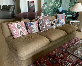 Vintage three-seat slipper sofa & throw pillows - 2 available. And, assorted vintage Persian rug pillows. Previous owner of the sofa: Tennis great, Chris Evert!