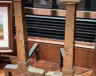 Antique andirons from the Wrigley estate. 