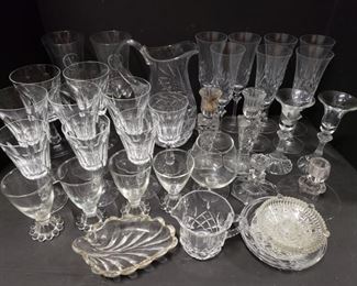 Includes champagne glasses, pitcher, goblets, sherry glasses, creamer and candle holders. Largest measures 10"H x 7"L and smallest measures 4"L x 2"H. https://ctbids.com/#!/description/share/1012607