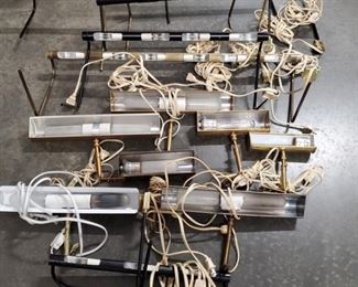 Collection of hanging lighting that is used to illuminate your fine art hanging on the walls. This set includes brass, black and white fixtures that range from 7"-40". Some will need lightbulbs replaced. https://ctbids.com/#!/description/share/1012662