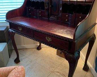 	#17	Writing desk with leather inlay top and claw feet. 39.5"x24"x42"	 $150.00 		