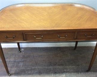 VINTAGE DESK ON BRASS WHEELS