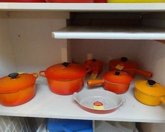 Enamel cast iron LeCreuset; several have stained interiors
