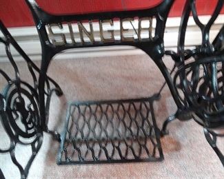 Singer cast iron base, has a wood top