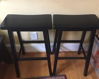 Pair of counter height black stools.