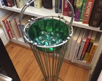 Metal holder with glass bowl.