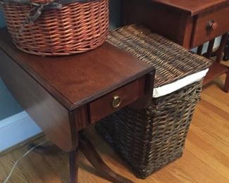 Small table and laundry basket.