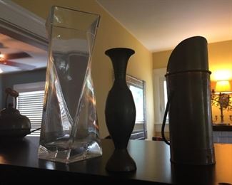 Brass items and glass vase.