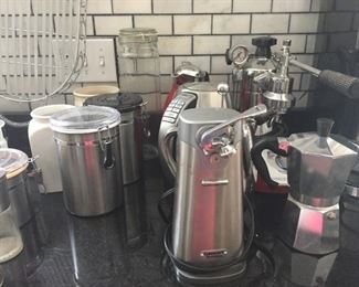 Espresso machine with assorted coffee pots.