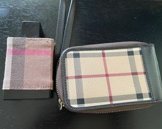 Burberry perfume and clutch.