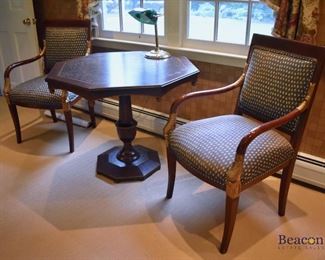 Octagonal pedestal table and dolphin carved armchairs