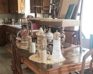 view of the dining room table and glass chandelier  
