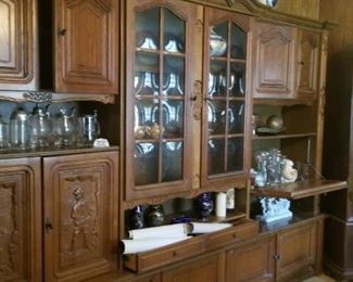 view of the living room schrank with lots of storage and display