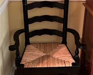 One of two black arm chairs