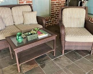 Settee, table, and one of two chairs
