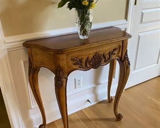 Carved wood demilune table