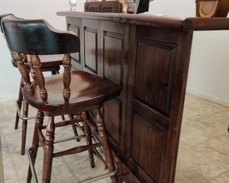 Ethan Allen to the rescue after a bad day!  This portable bar, folds down, has locking storage(keep the booze safe from the teens) and rolls.  @ bar stools as well. 