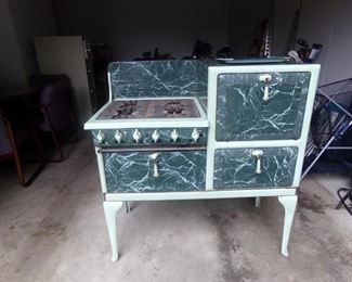 WOW_showstopper stove!  Incredible finish-marbled enamel!  Great shape-needs a hinge repair on one drawer.  Never seen such a great finish!