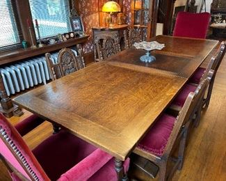 Wonderful expansive oak dining table with 8 chairs