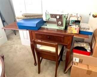 Sewing machine with table and chair