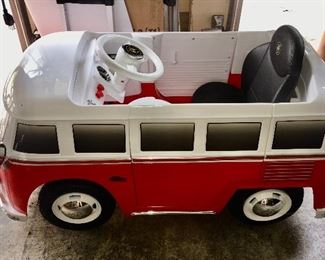 Battery operated child's ride-on toy VW bus.