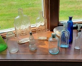 Misc bottles, some found at property 