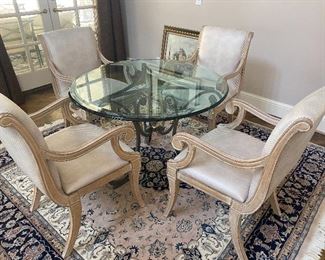 4 Casa Stratavari armchairs and 3-1/2’ round glass table on metal base