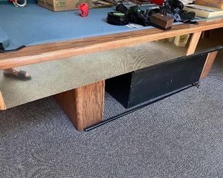 Olhausen pool table. 9 feet 5 inches by 5 feet 3 inches, playing surface is 8 feet 4 inches by 4 feet 3 inches.