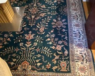 Green office rug. 9 feet by 5 feet 8 inches.