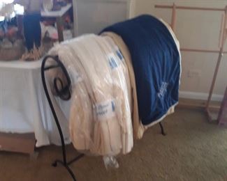Quilt rack  made of steel
Set of window sheers 
And  quality drapes, Silk?