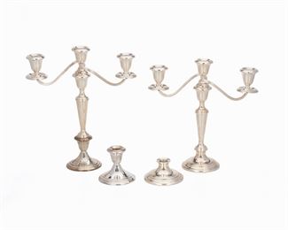 1002
A Gorham "Puritan" Sterling Silver Convertible Candelabra Suite
Second-half 20th Century
Each marked for Gorham; Further marked: Sterling / Weighted / Reinforced with Other Metals; Numbered: 661 / 808 / 1
Comprising two three-light modular candelabrum with swirling reeded arms and tapered column raised on circular foot, branched module, column, and foot all detachable, accompanied by two additional feet, 4 pieces
Each: 13.25" H x 11.5" W x 3.75" W
Estimate: $400 - $600