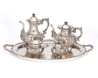 1003
A German Sterling Silver Tea And Coffee Service
20th Century
Marked: Handarbeit / Schrolz / 925 / Sterling
Each with repousse floral decoration raised on flared feet, comprising a coffee pot (10" H x 8.75" W x 6" D), a teapot (8" H x 9.75" W x 6.5" D), a creamer (5.625" H x 5.5" W x 3.75" D), a covered sugar bowl (5.5" H x 6.75" W x 4.5" D), and a handled tray (1.75" H x 24.5" W x 15.25" D), 5 pieces
133.51 oz. troy approximately
Estimate: $2,000 - $3,000