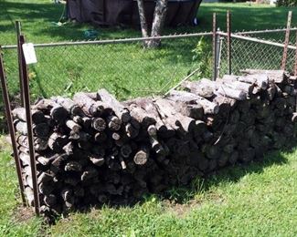 Assorted Firewood With Metal Posts