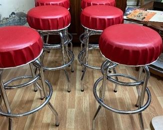 Antique soda shop bar stools restored with bottle cap seats 