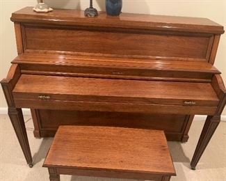 Baldwin fruitwood spinet piano.