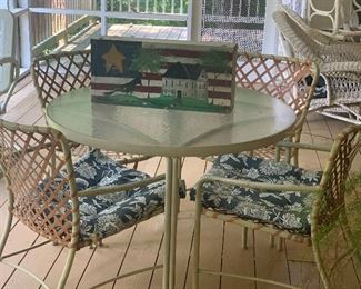 Patio table and chairs. Folk art bench decoration.