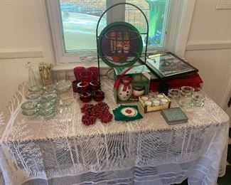 Christmas decor including candles and holders.