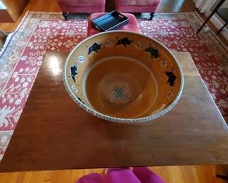 Signed pottery bowl with Buffalo design inside.