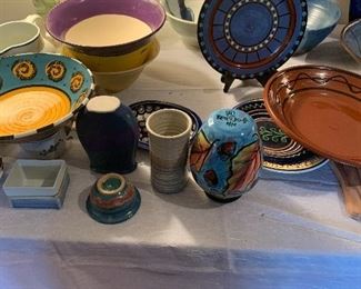 Various signed artisan pottery.
