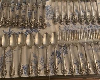 8 - 4 piece place settings of Wallace  Grande Baroque sterling flatware.