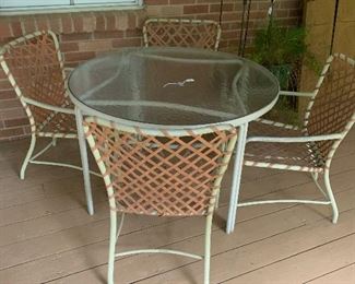 Patio set and metal plant stand.