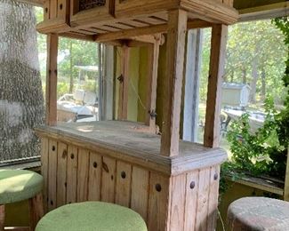 Rustic looking bar, and four barstools